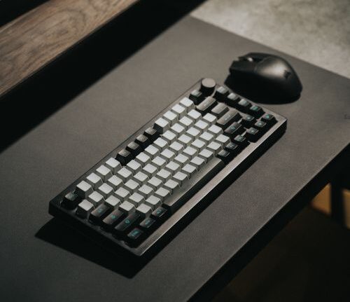 Wireless mouse and keyboard set up on an office desk for remote work productivity