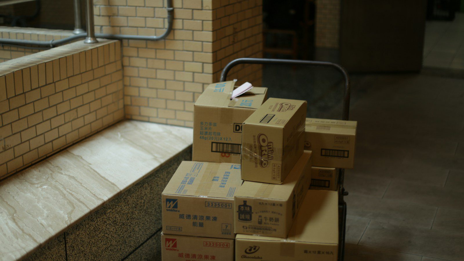 Cardboard boxes stacked on a rack ready for cross-border shipping