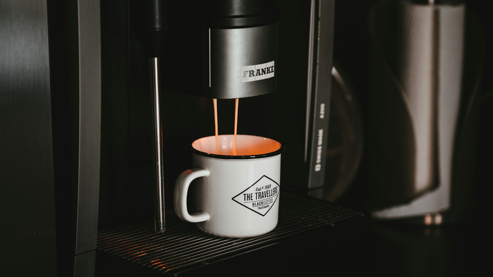 Fresh coffee filling a mug, illustrating travel mug size and capacity