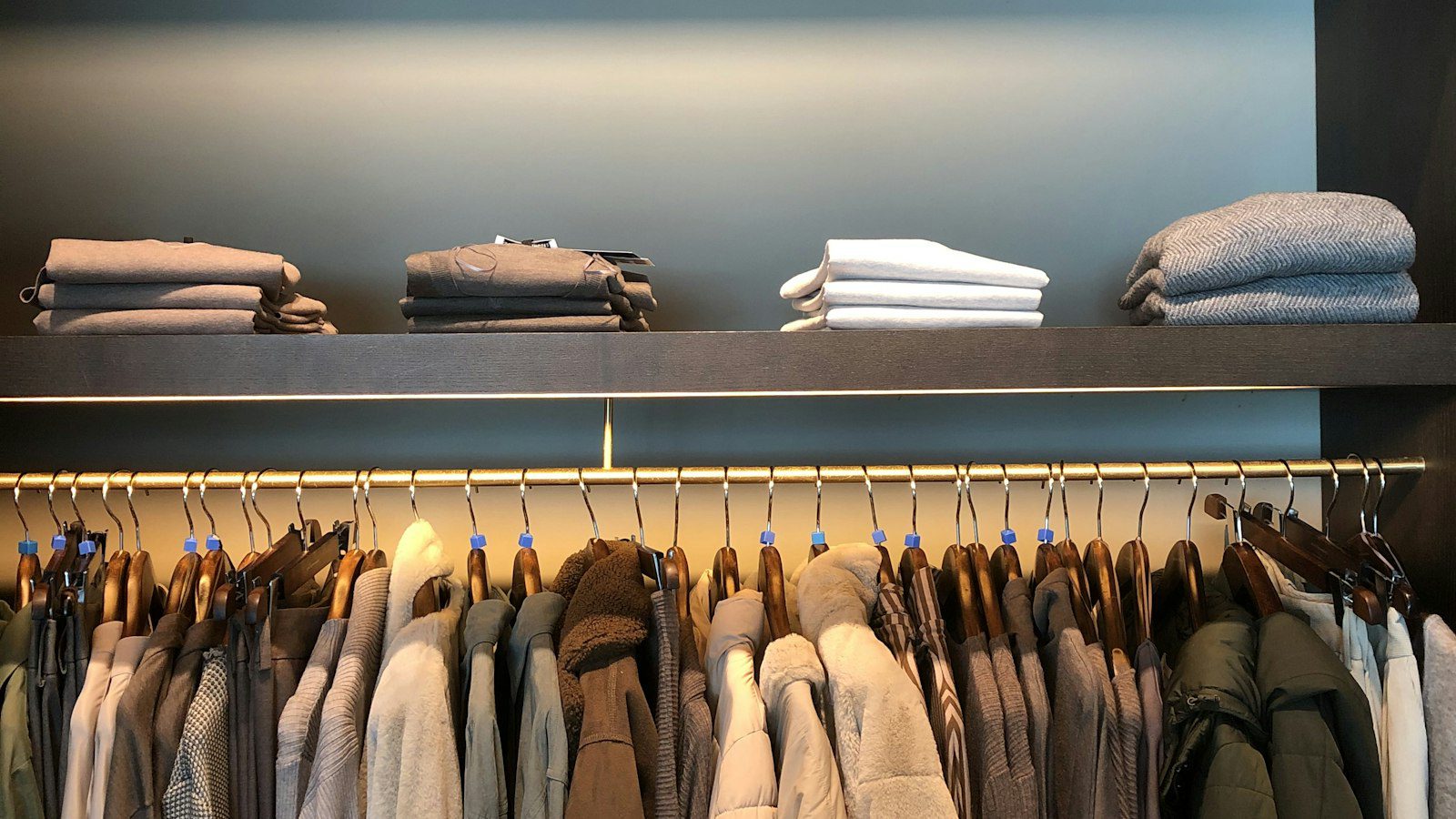 Folded and hanging clothes forming versatile office outfits