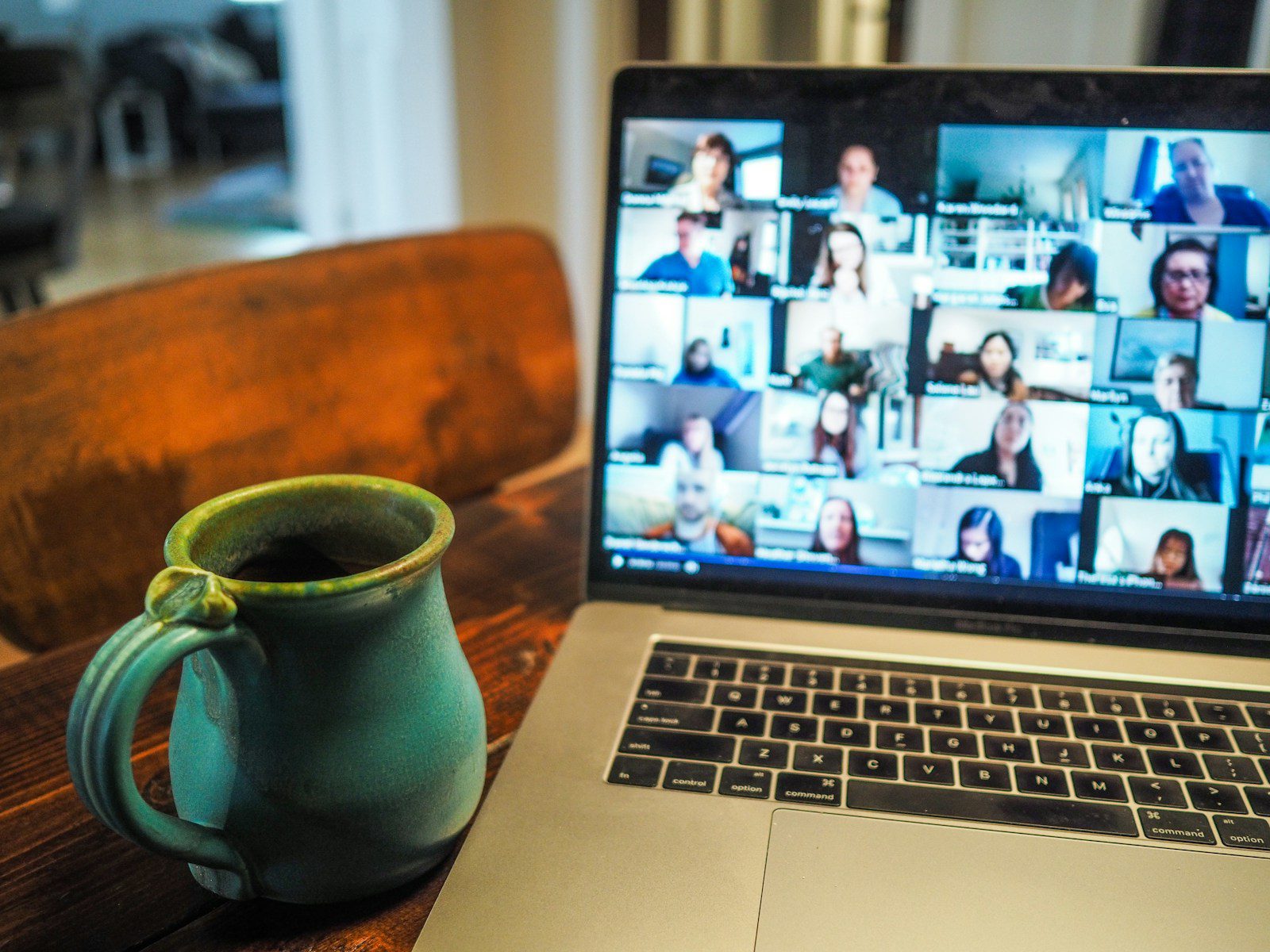 Laptop displaying a video meeting with a webcam for remote work in Canada