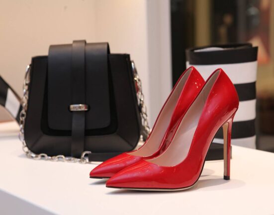 Pair of comfortable women's work shoes next to a bag, ready for the office