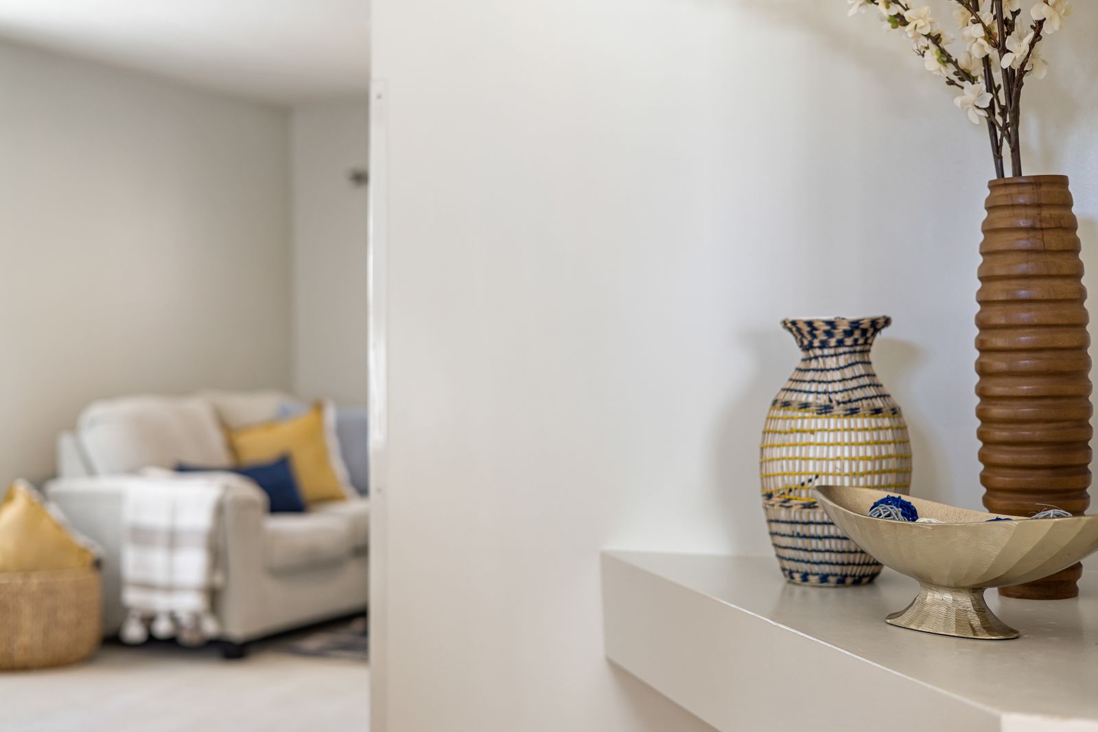 Decorative accents arranged on a shelf, affordable room accents for budget home decor planning