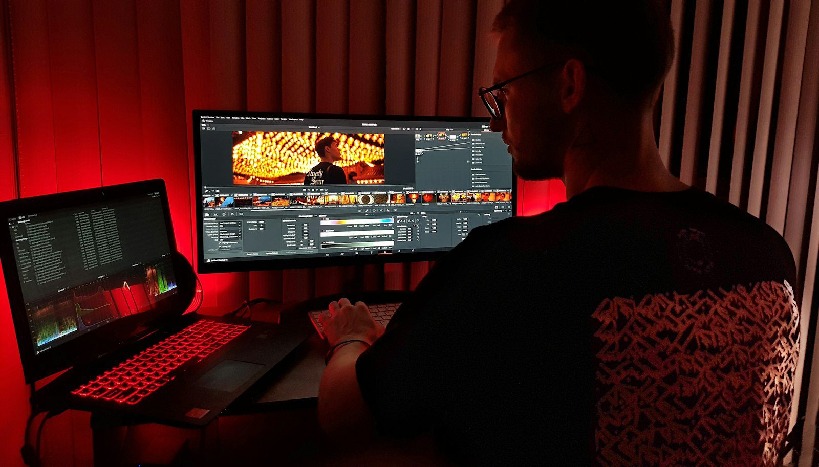Creator working at a computer on an AI video workflow comparison