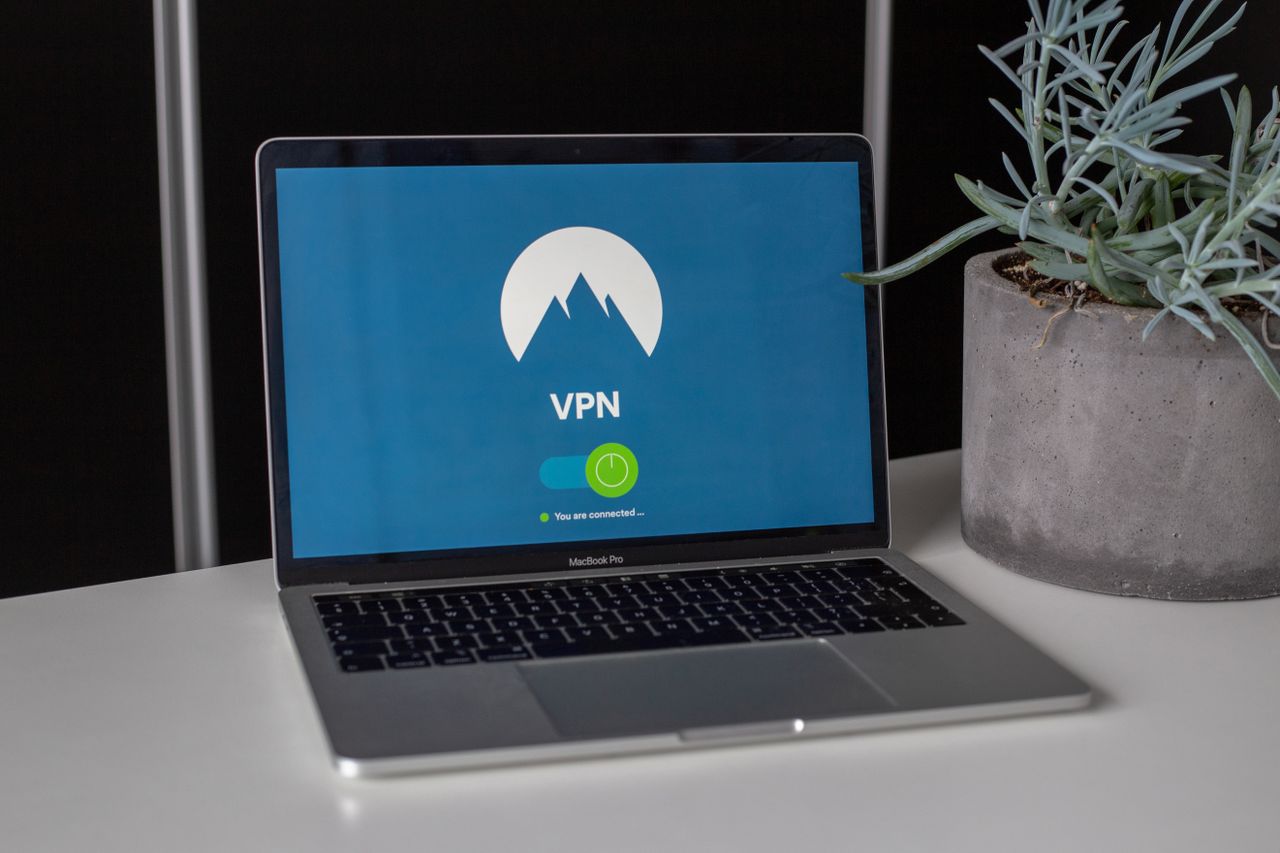 Laptop on a desk showing a security application for cross-platform malware protection