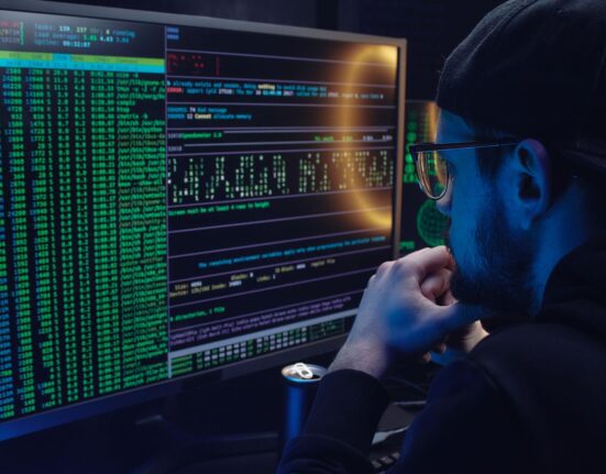 Security analyst monitoring threats to compare antivirus plans for multiple devices
