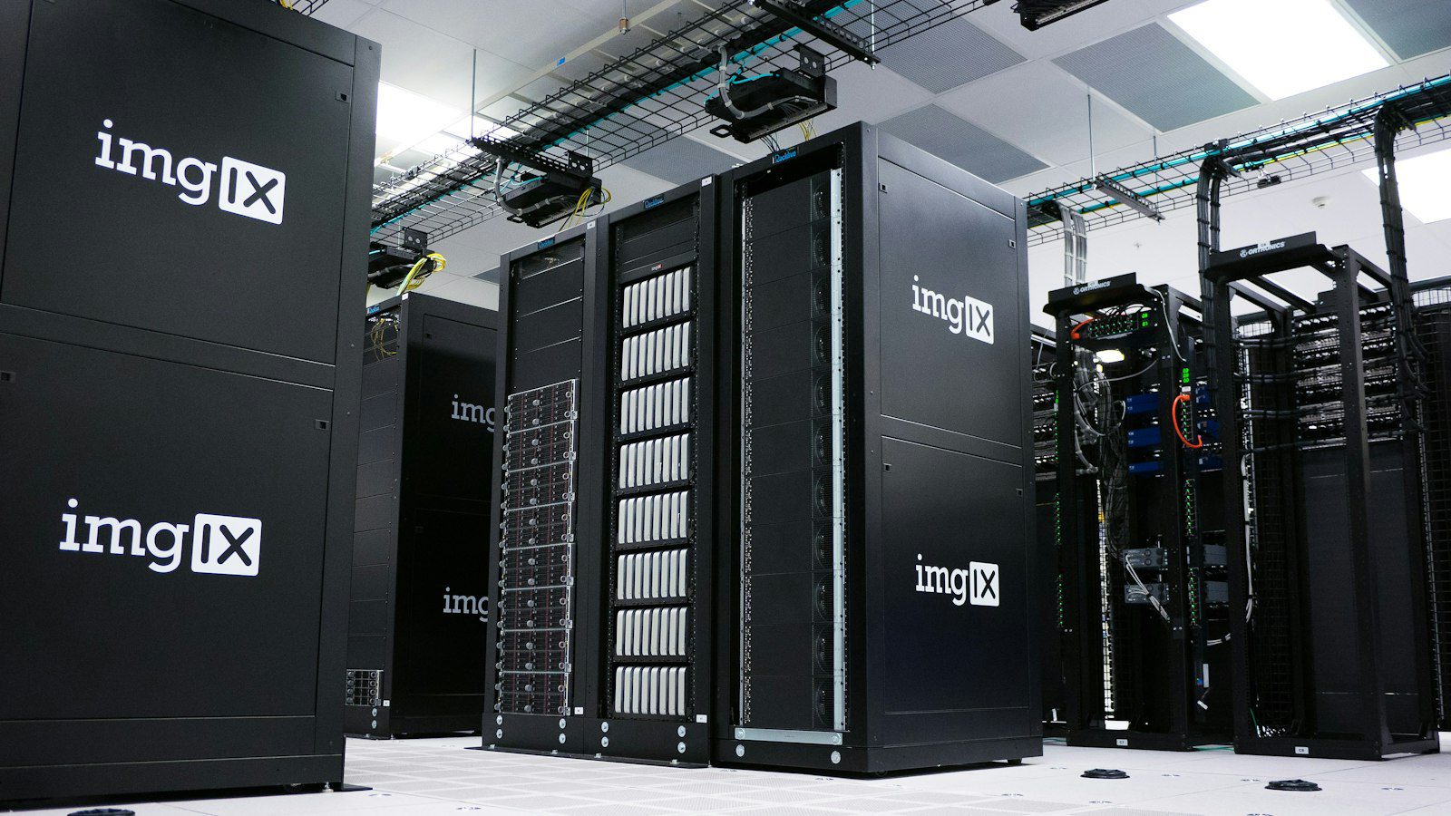 Rows of server racks in a data centre for business application hosting comparison