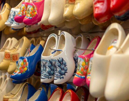 Colourful clogs on display, illustrating clogs vs sandals for casual summer wear in the United Kingdom