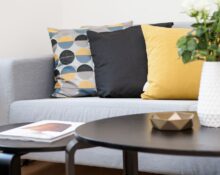 Living room with coordinated decor accessories on a coffee table, home decor on a budget