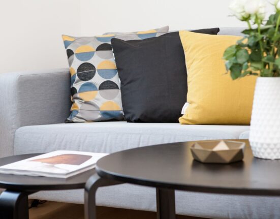 Living room with coordinated decor accessories on a coffee table, home decor on a budget