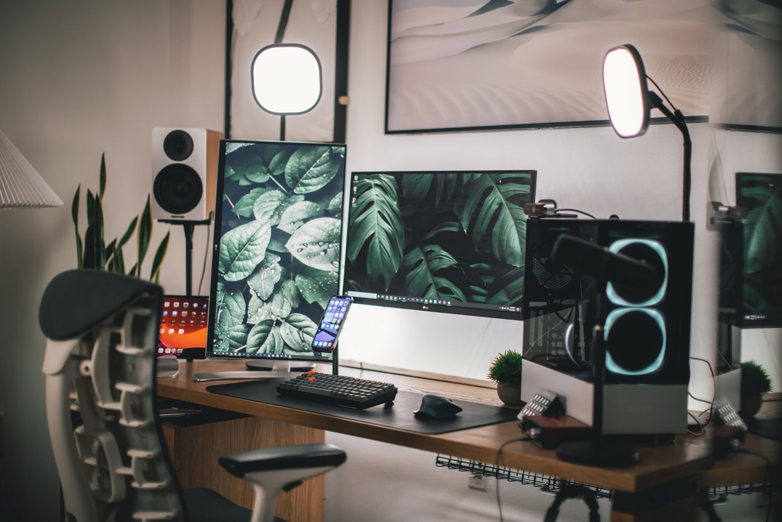 Flat screen computer monitor and keyboard on a white desk