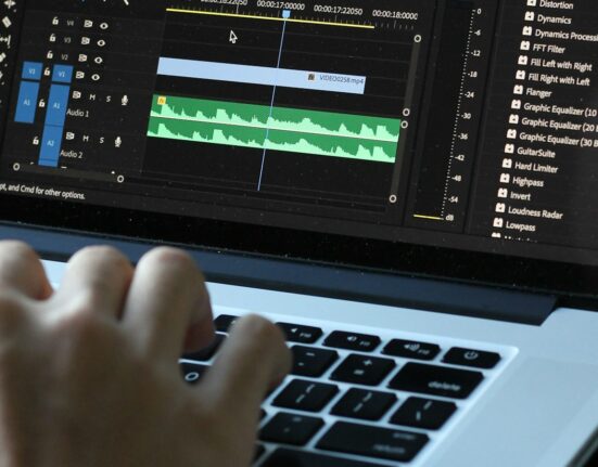 Person using a laptop to test free AI video generator limits in the United Kingdom