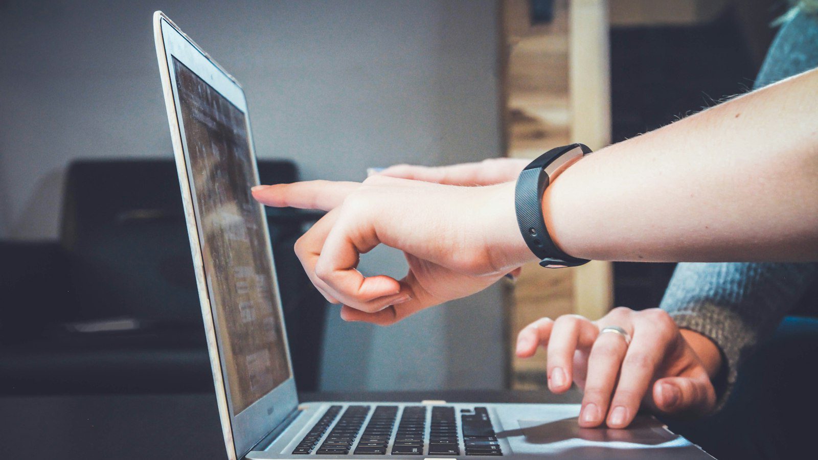 Person reviewing a laptop screen to check free video generation credits in Canada