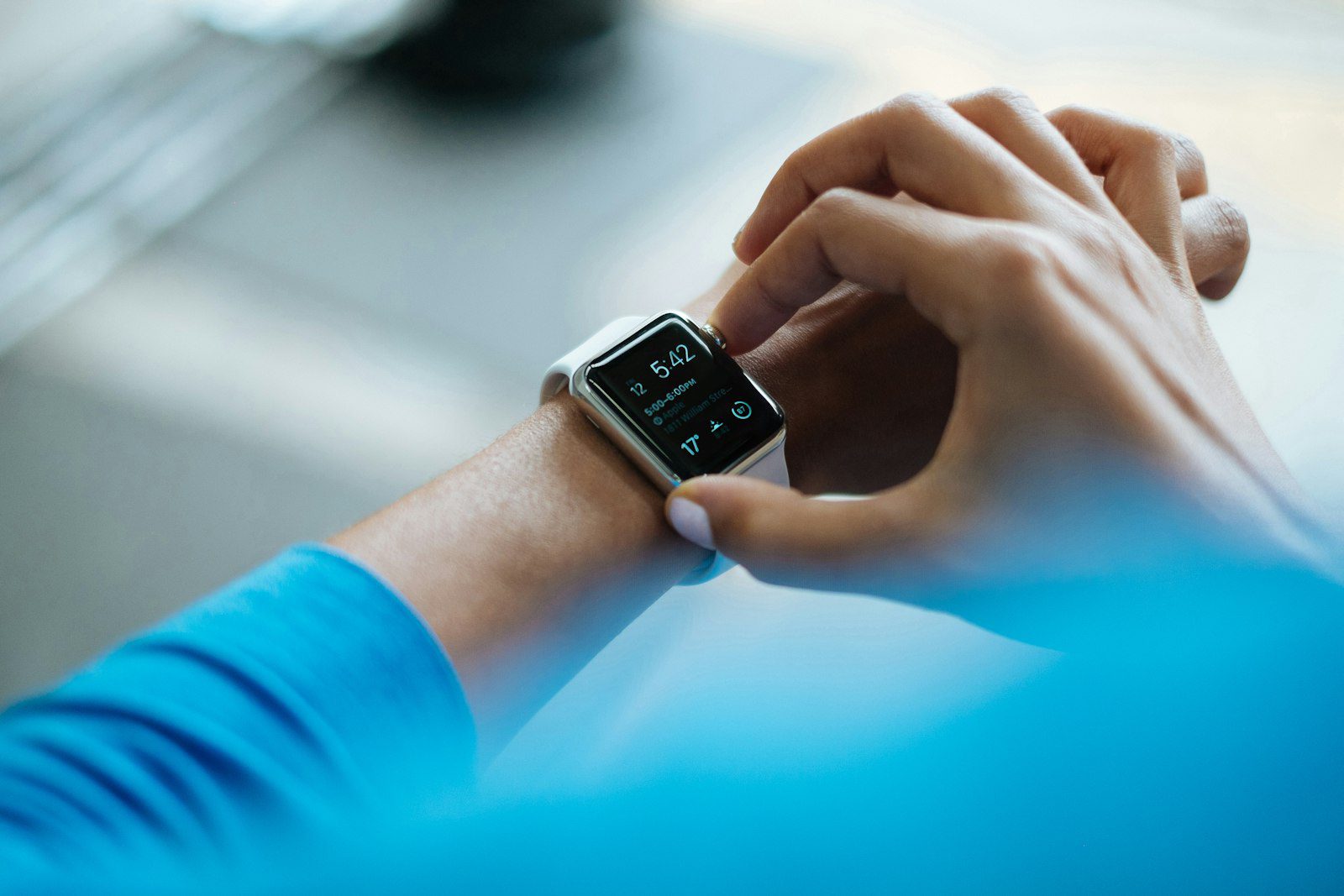 Person checking a smartwatch dashboard, illustrating a health tracker sensor checklist