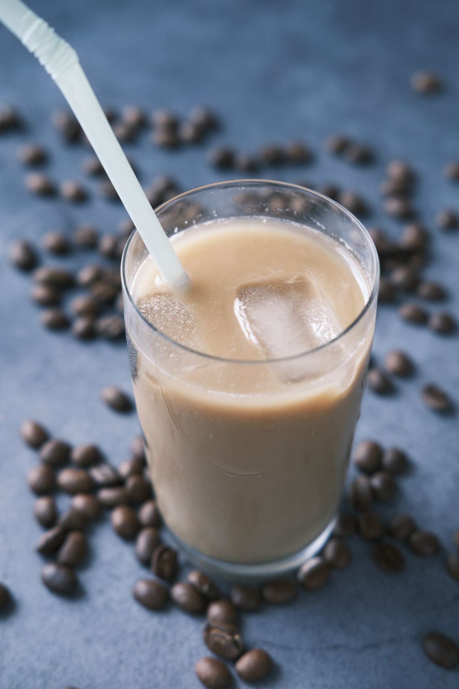 Iced coffee in a clear glass with a straw