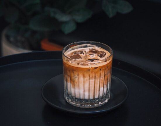 Glass of iced coffee with ice cubes for coffee concentrate vs cold brew
