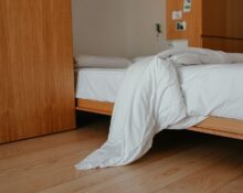 Rumpled bed with soft sheets illustrating linen sheets vs cotton sheets