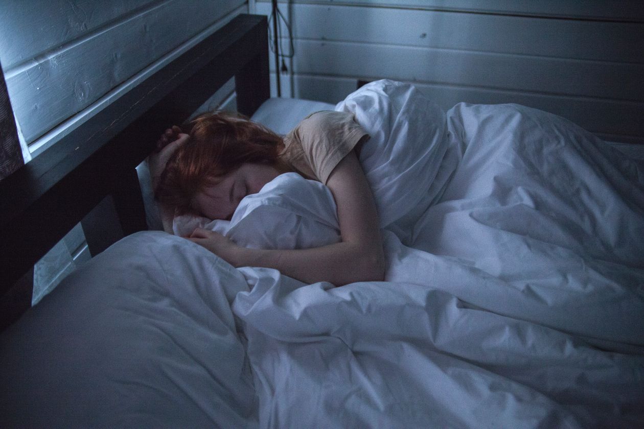 Person sleeping comfortably, showing how mattress firmness suits a sleep position