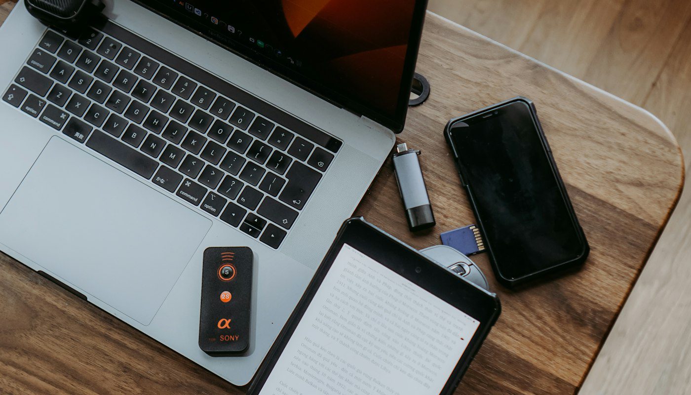 Laptop, tablet and phone on a desk illustrating multi device antivirus coverage in Canada