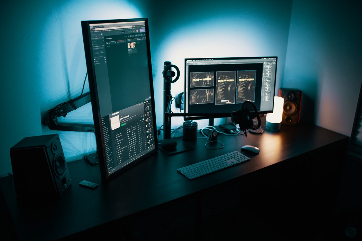 Home desk setup with several screens illustrating multi device antivirus coverage in the UK