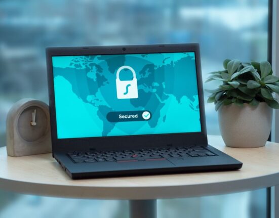 Laptop displaying a padlock icon representing multi-device antivirus protection