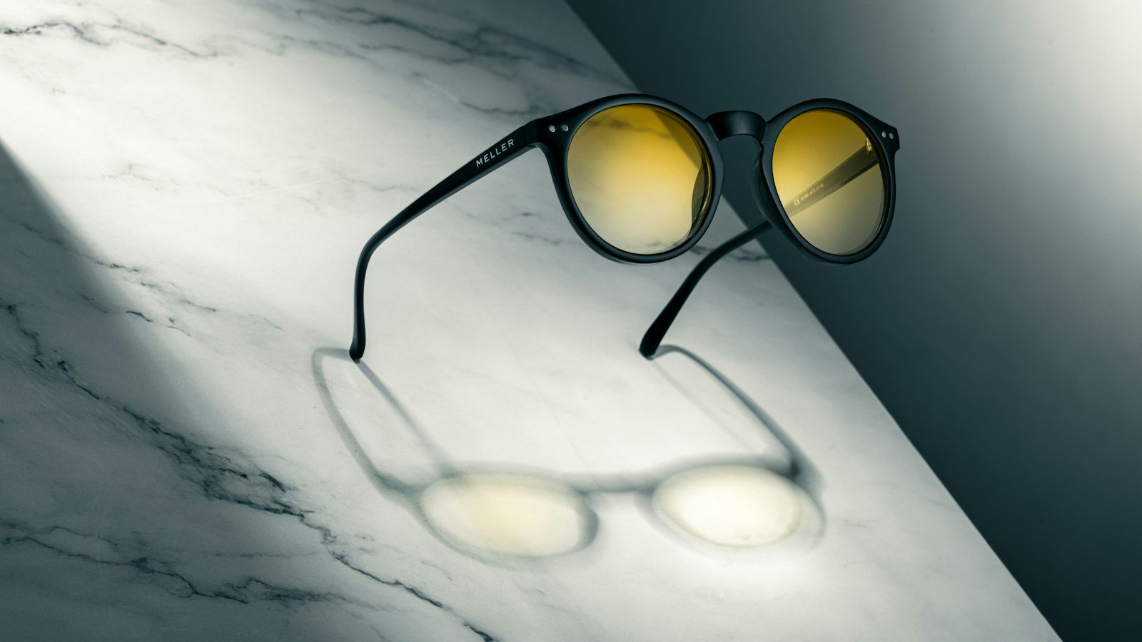 Sunglasses styled on a table as a source product photo for a product photo video maker in the UK
