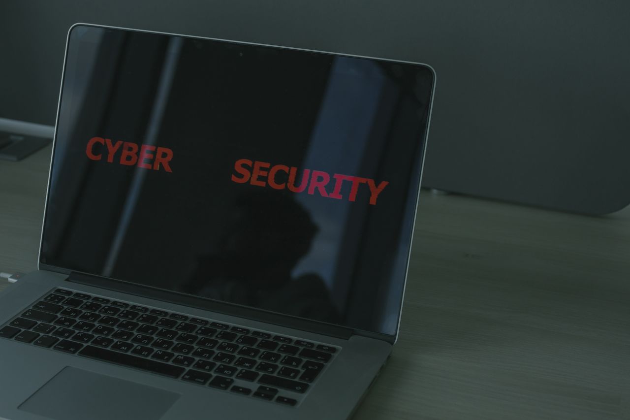 Close-up of a laptop screen showing cybersecurity text for a security suite feature comparison