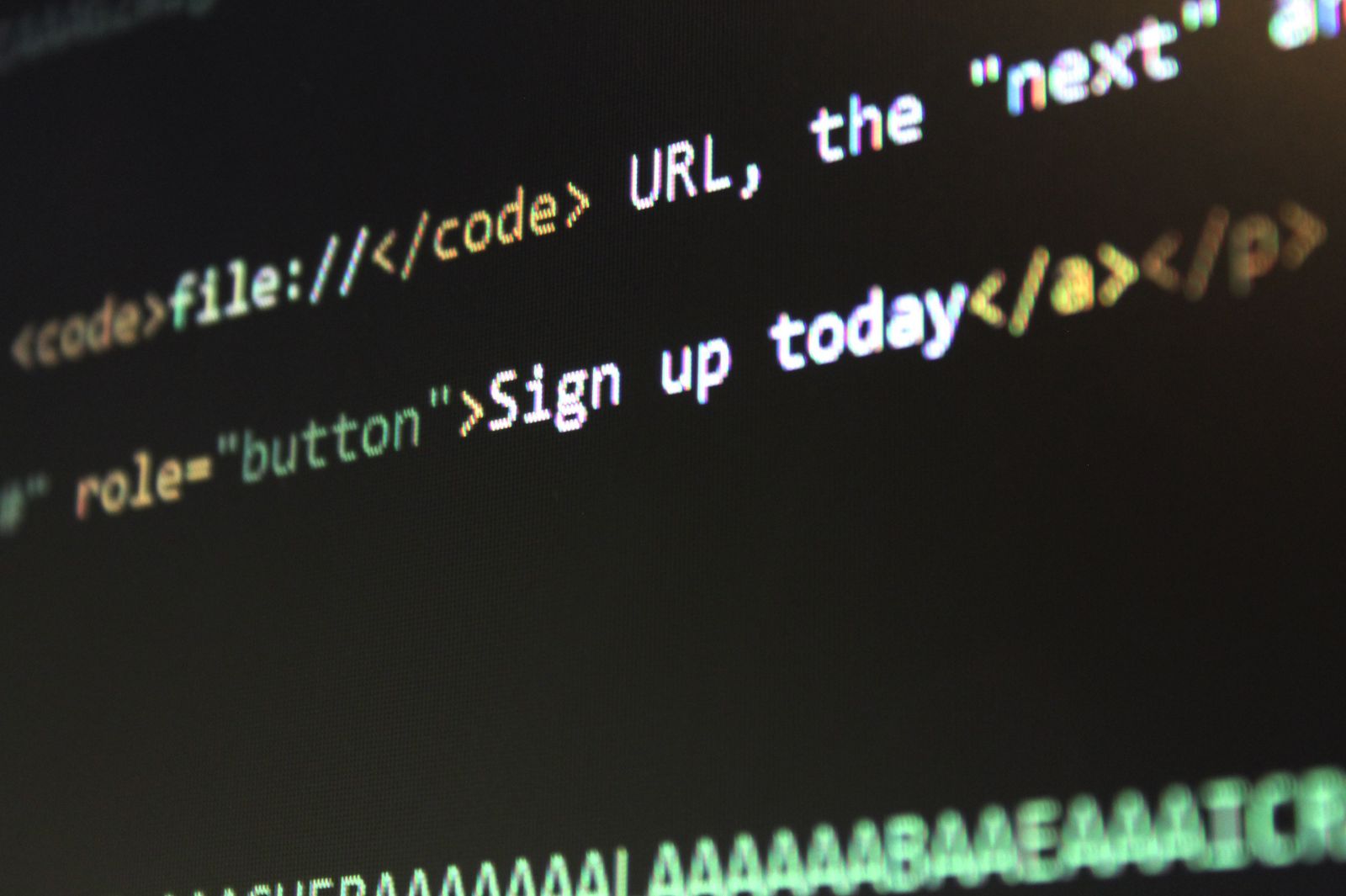 Close-up of code on a screen representing a security suite feature comparison