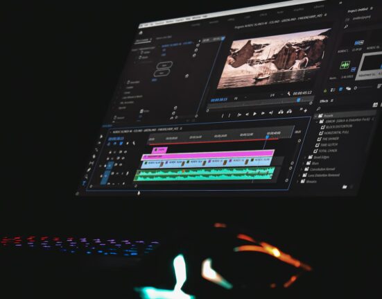 Video editing timeline on a monitor comparing text to video AI vs template video makers