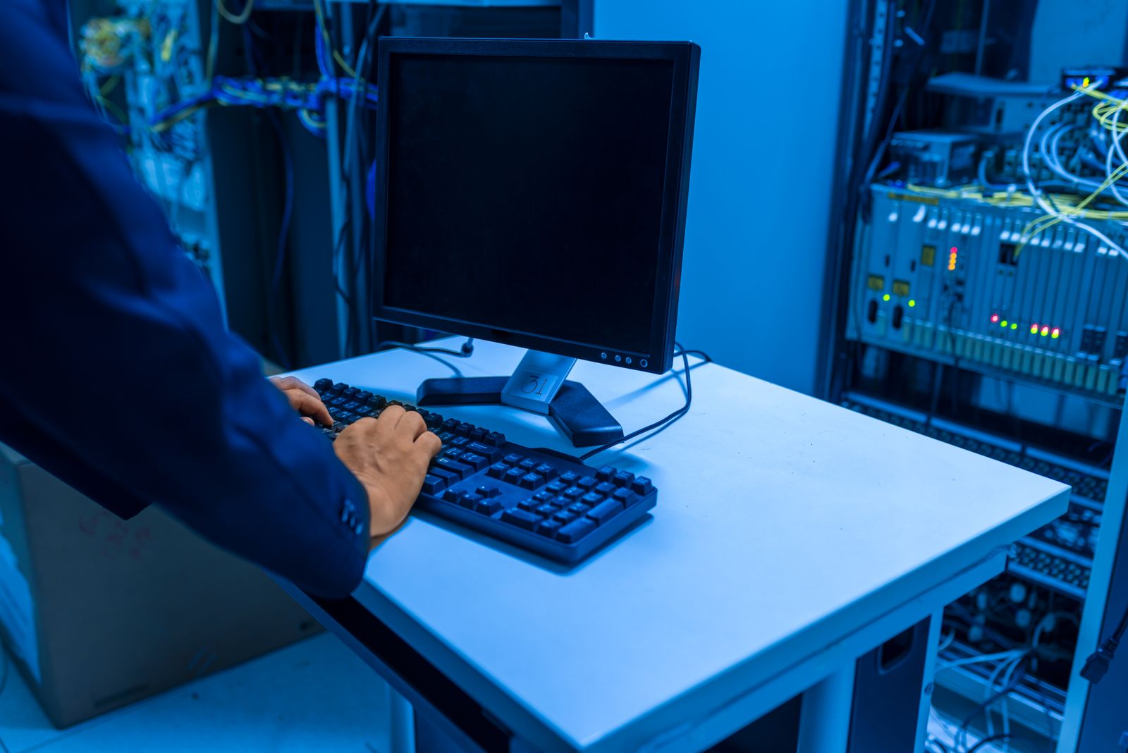 IT technician working in a server room to manage a VPS for a growing website