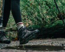 Hiker wearing waterproof hiking boots on a rocky trail
